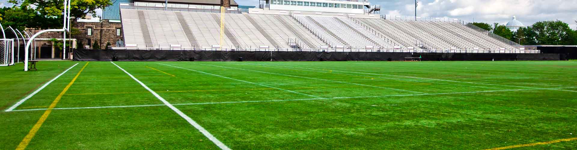 Artificial grass installation for a school football field in Hawaii